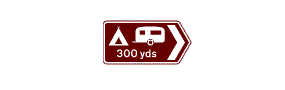 A brown rectangle containing a chevron arrow pointing right, a picture of a tent and caravan and the measurement 300 yards