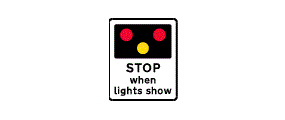 The words Stop When Lights Show below a black rectangle with two red dots above a single yellow dot inside it