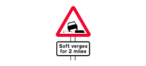 The words Soft Verges For 2 Miles inside a white rectangle below a picture of car driving on a verge inside a red outlined triangle